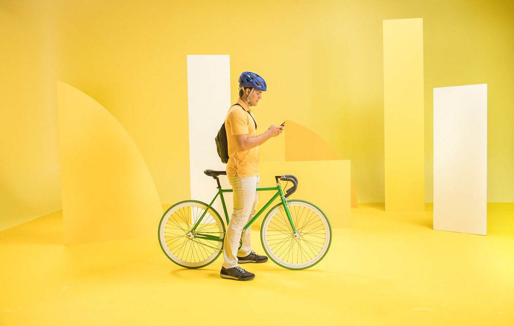 Yellow studio portrait with bicycle