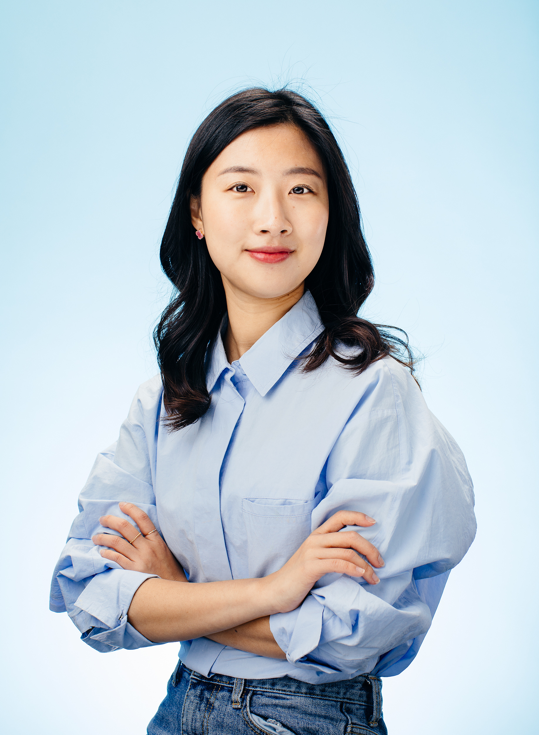 Studio portrait on pale blue backdrop